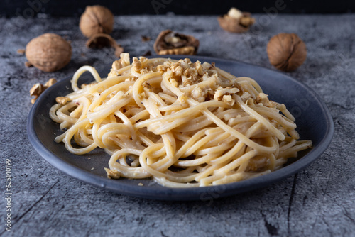 Spaghetti with walnut cream. Simple  nutritious and tasty dish suitable for those who follow a vegetarian diet.