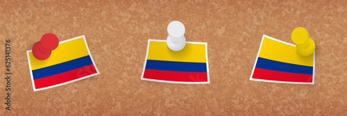 Colombia flag pinned in cork board, three versions of Colombia flag.