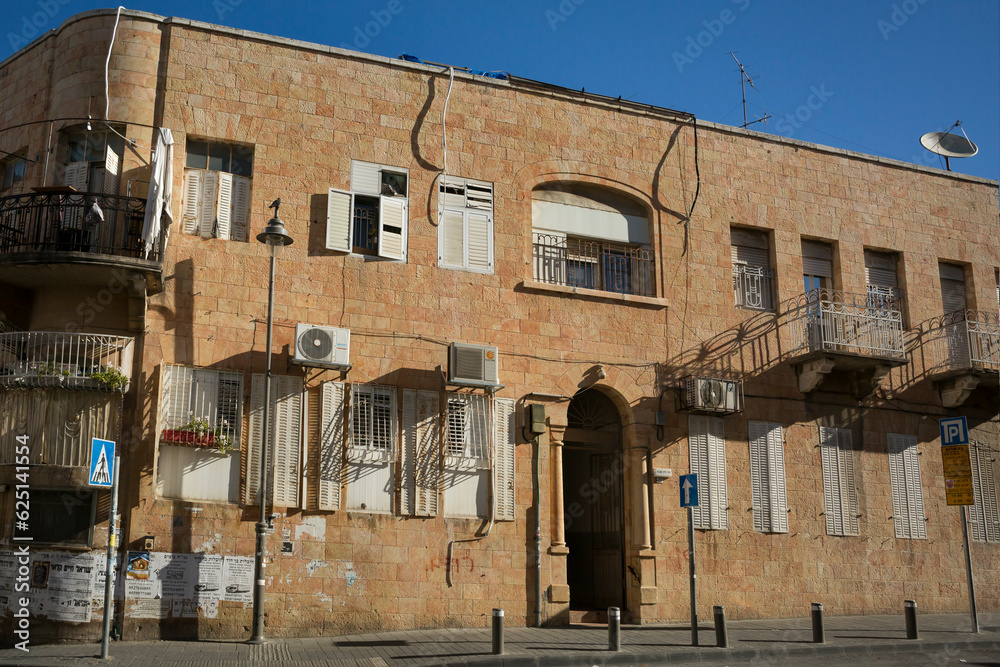 Building on a Street of Mea Shearim, one of the oldest Jewish neighborhoods populated by Haredi Jews, in West Jerusalem Building on a Street of Mea Shearim, one of the oldest Jewish neighborhoods populated by Haredi Jews, in West Jerusalem