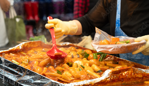 Delicious Korean cuisine Tteokbokki, spicy rice cake in market, street food.