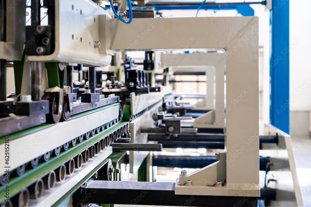 A industrial commercial envelope making machine, making paper envelopes for international distribution. Automated engineering machinery for mass production of paper envelopes. A industrial commercial envelope making machine, making paper envelopes for international distribution. Automated engineering machinery for mass production of paper envelopes.