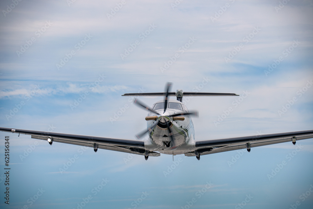 A Pilatus PC-12 as seen from the front in flight A Pilatus PC-12 as seen from the front in flight
