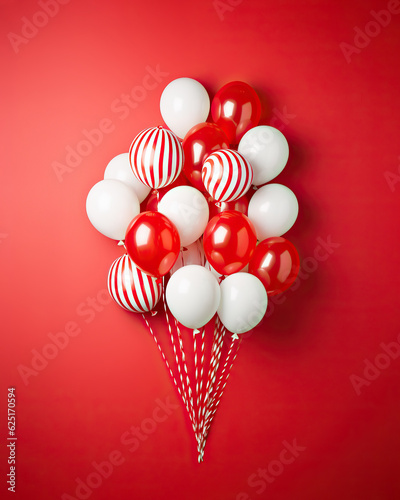 A vibrant explosion of love radiates from the room as a mass of heart-shaped balloons in a spectrum of reds fill the space photo