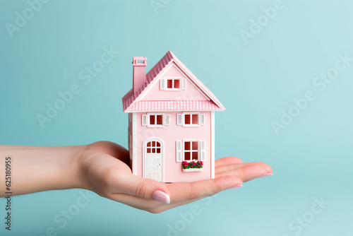 Hand holding a miniature house model. Real estate, investment, property insurance, mortgage, home loan, and savings concept. Buying or building new home. Dream house, financial planning. AI generated