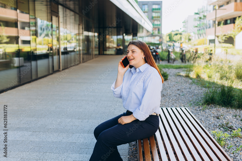 Outdoor lifestyle fashion portrait of woman talking on phone on the street. Close up of woman using smartphone outdoors. Urban lifestyle concept Outdoor lifestyle fashion portrait of woman talking on phone on the street. Close up of woman using smartphone outdoors. Urban lifestyle concept
