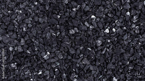 Small dark stone texture for background, ​​pattern of gravel stone wall texture or stone background