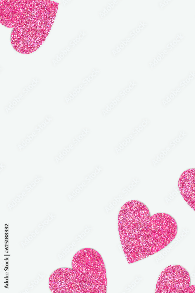 Obraz premium Frame made of pink glittering hearts. Festive concept on a blue background.