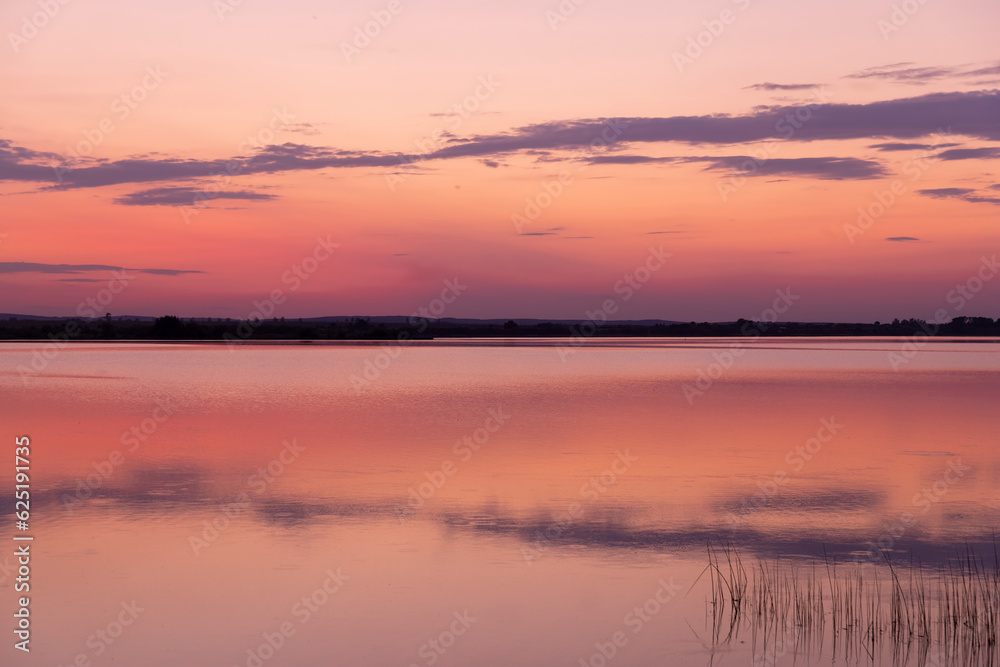multicolored sky during sunset on the lake