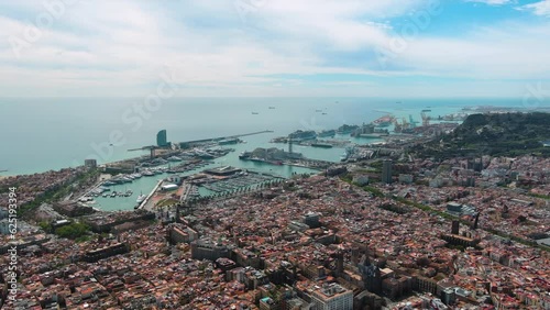 Barcelona city urban panoramic skyline top view in central district cityscape outdoor with commercial port seen from above ft aerial coastline panorama Somorrostro Beach in Catalonia, Spain 4K UHD photo