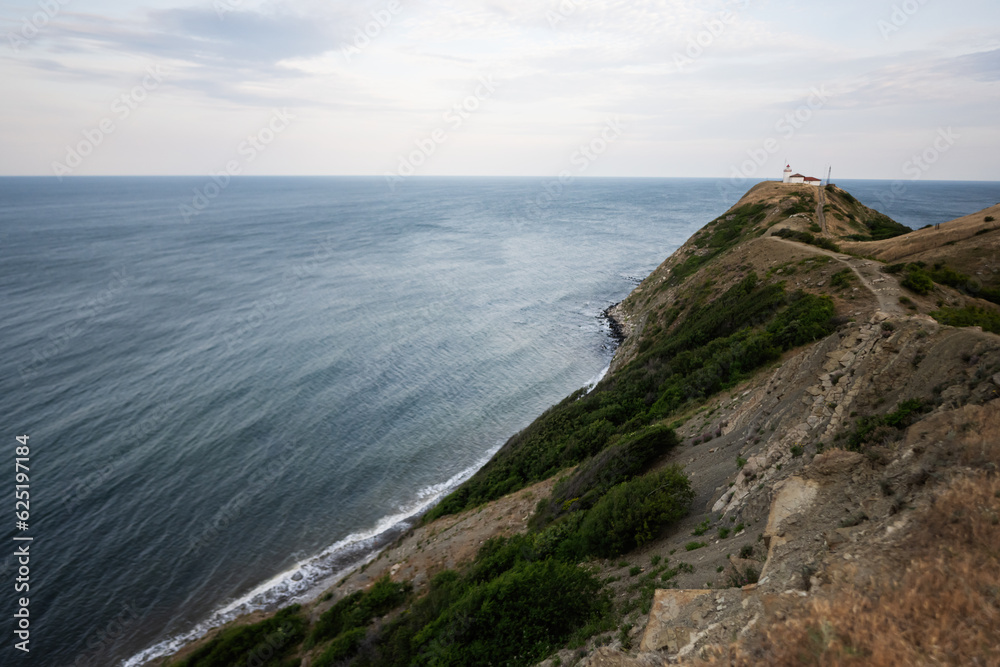 Aerial view of the lighthouse at the entrance to the sea. Cape Emine, Black sea coast, Bulgaria. Aerial view of the lighthouse at the entrance to the sea. Cape Emine, Black sea coast, Bulgaria.