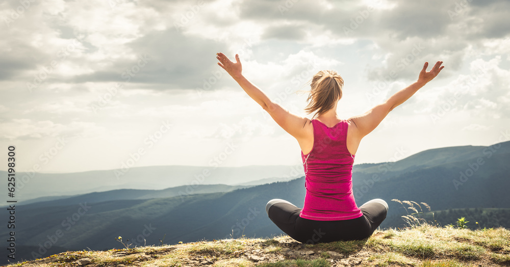 Young woman on the top of mountain Young woman on the top of mountain