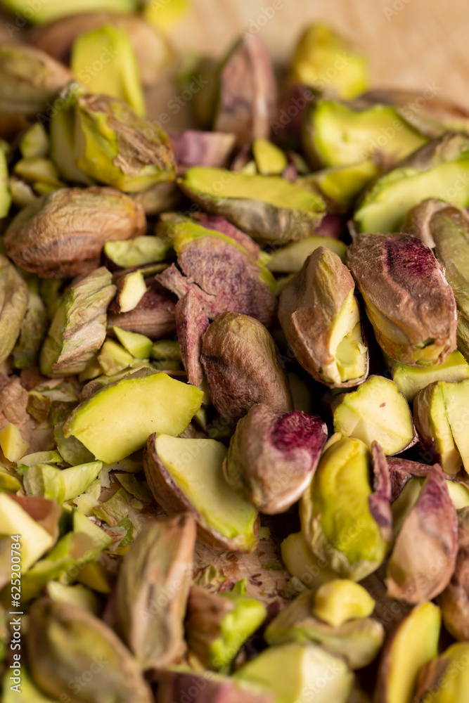 Crispy delicious pistachios with salt on the table Crispy delicious pistachios with salt on the table