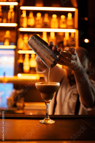 bartender pouring cocktail