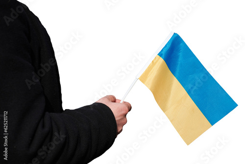 A person in black clothes holds a small flag of Ukraine, isolated. Support for Ukraine