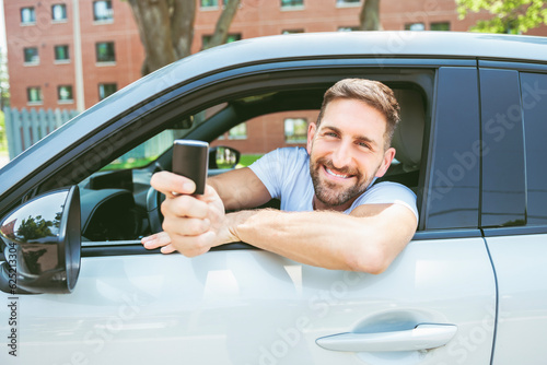 Mid adult man feeling comfortable on driver seat in his new car.