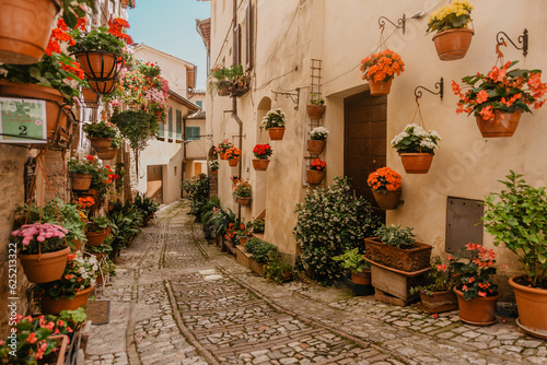 narrow flower street in the city of spello in italy