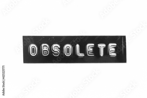 Black color banner that have embossed letter with word obsolete on white paper background