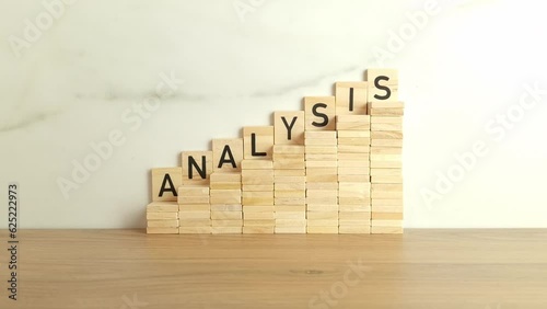 Word analysis made from wooden blocks. Business concept
