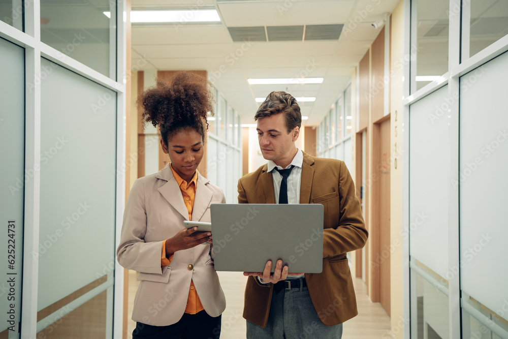 Professionals having a discussion, Successful business team working together in a co-working office Professionals having a discussion, Successful business team working together in a co-working office