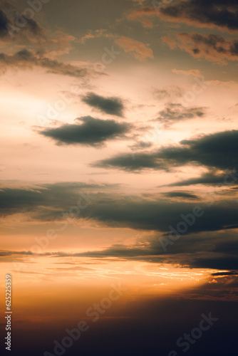 Beautiful view of the evening orange sky with black clouds