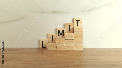 Word limit made from wooden blocks. Business concept