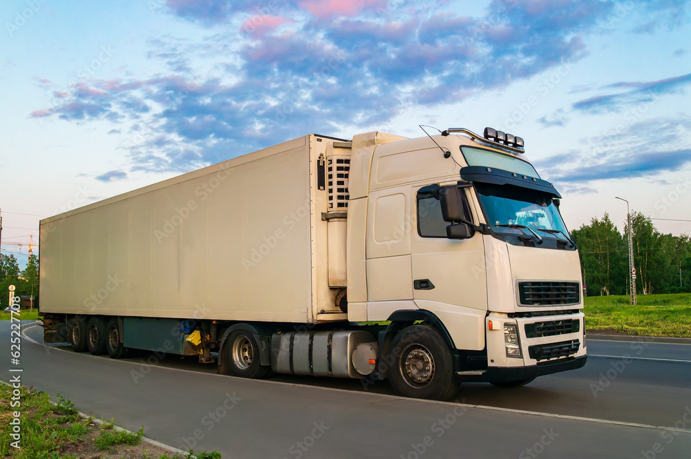 A white truck stands on the side of the road A white truck stands on the side of the road