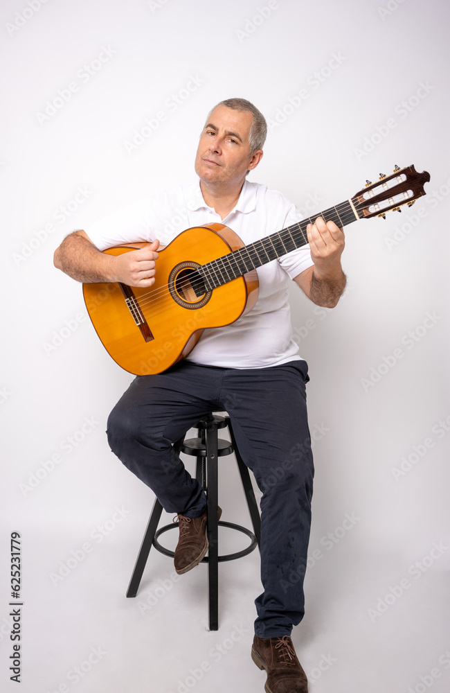 Obraz premium Full length portrait of Adult man playing guitar isolated on white background