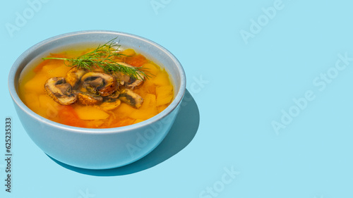 Wallpaper Mural Bowl of Pumpkin Mushroom Soup on blue background with copy space. Torontodigital.ca