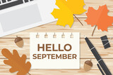 paper with hello september text, flat lay composition with laptop, autumn leaves on wooden desk- vector illustration
