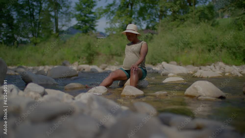 Lifestyle Portrait of Black Single Mother During Pregnancy Happy and Relaxed in Motherhood Time Outdoors Lifestyle Portrait of Black Single Mother During Pregnancy Happy and Relaxed in Motherhood Time Outdoors