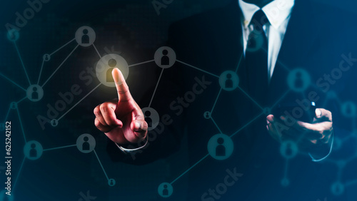 Wallpaper Mural Businessman is using smartphone and touching global structure networking and data exchanges customer connection against dark background. Torontodigital.ca