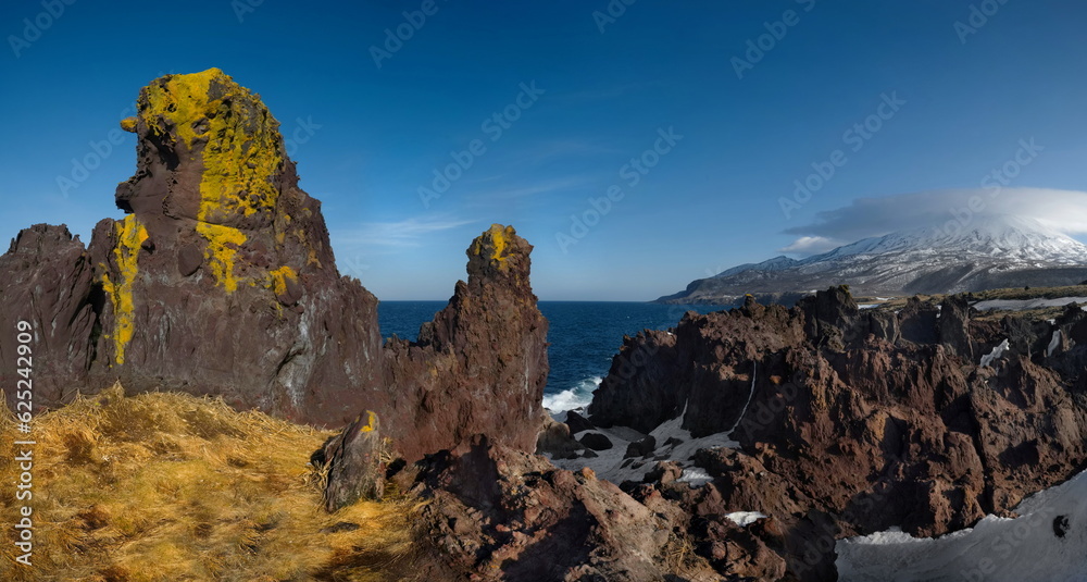 Russia. Far East, Kuril Islands. Very hard and sharp basalt rocks along the coast of the Sea of Okhotsk on the island of Iturup.
