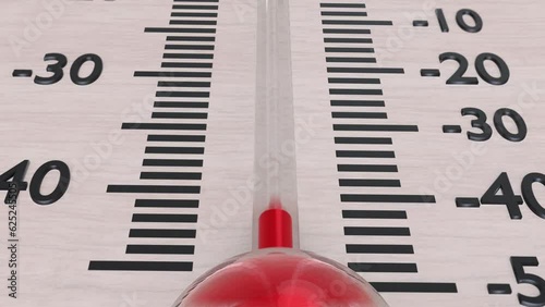 Macro shot of rising temperature in wooden thermometer. Animation showing the rising red temperature.