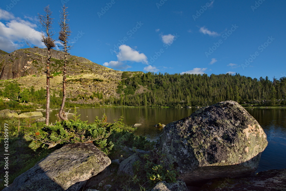 Russia. The south of the Krasnoyarsk Territory, the Eastern Sayans. Summer evening on the Rainbow Lake in the Ergaki natural Mountain Park (from the Turkic Russia. The south of the Krasnoyarsk Territory, the Eastern Sayans. Summer evening on the Rainbow Lake in the Ergaki natural Mountain Park (from the Turkic