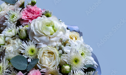 Bouquet of ranunculus and chrysanthemum flowers. Place for text