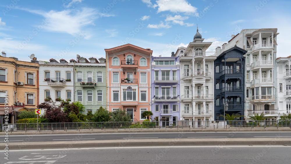 Colorful traditional residential buildings overlooking Bosphorus strait, in Arnavutkoy neighborhood, Besiktas district, Istanbul, Turkiye, in a sunny spring day