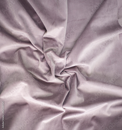 pink velvet with pleats, folded crumpled bed textile, luxury silk fabric background and copy space