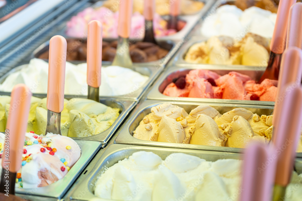 Ice cream display case with lots of trays with different flavors Ice cream display case with lots of trays with different flavors