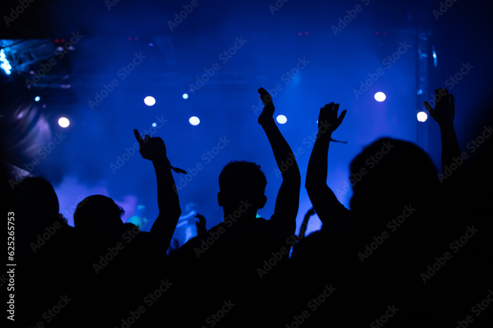 Abstract photo of crowd at concert and blurred stage lights. Abstract photo of crowd at concert and blurred stage lights.