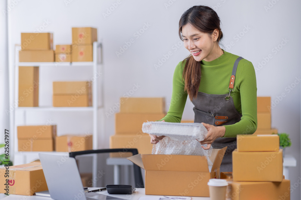 Startup happy Asian woman business owner works with a box at home, prepare parcel delivery SME supply chain, procurement, package box to deliver to customers, Online SME business entrepreneurs ideas,
Startup happy Asian woman business owner works with a box at home, prepare parcel delivery SME supply chain, procurement, package box to deliver to customers, Online SME business entrepreneurs ideas,