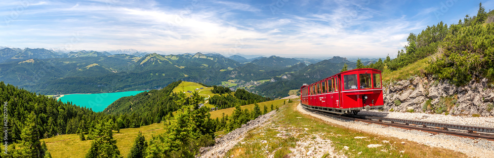landscape with mountains and a lake Wolfgangsee and Schafberg cog railway train Schafbergbahn, Alps, Austria