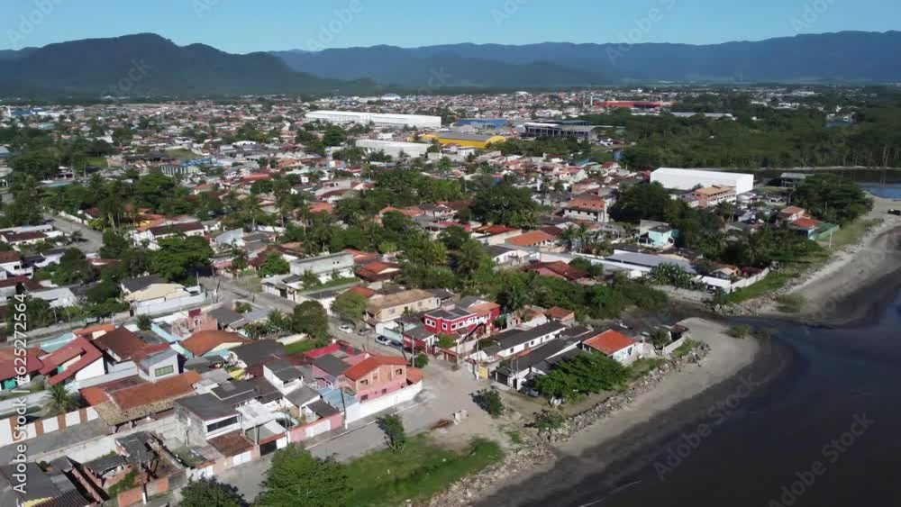 Small coastal village with peaceful beach and beautiful mountains Small coastal village with peaceful beach and beautiful mountains