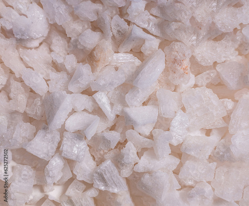 super makro shot salt from the deep. Spice and vegetarian concept. Pale pink and white big crystal background.