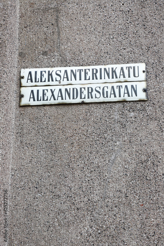 Bi-lingual street name sign for the Alexanterinkatu street in downtown Helsinki.