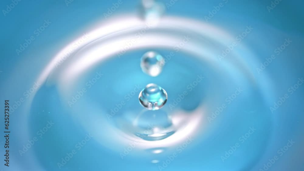 Super Slow Motion Detail Shot of Droplet Falling into Still Water Surface at 1000fps. Super Slow Motion Detail Shot of Droplet Falling into Still Water Surface at 1000fps.