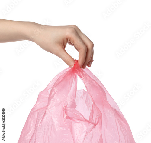 Woman holding pink plastic bag on white background, closeup