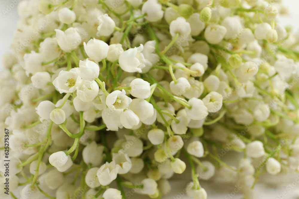 Beautiful lily of the valley bouquet as background, closeup