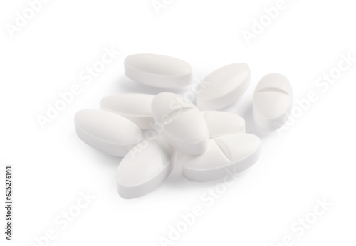 Many pills isolated on white. Medicinal treatment