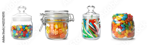 Set of different sweet candies in glass jars isolated on white