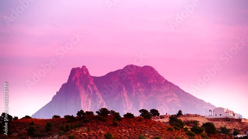 Timelapse. Peak Puig Campana at sunrise. Alicante province, municipality of Finestrat. View from Xarco coast. photo